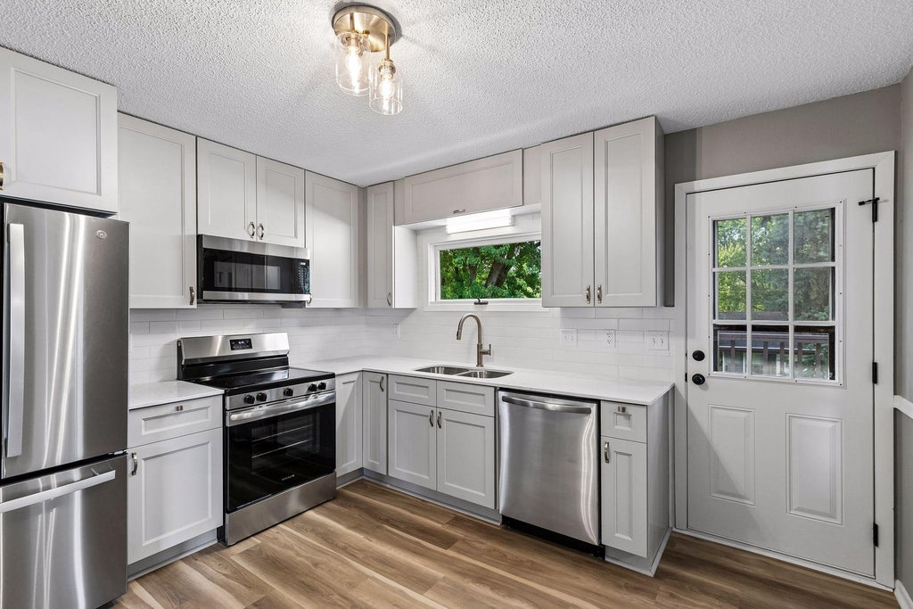 Photo of 963 Marnie Street S, Maplewood, MN 55119 (MLS # 7138904)