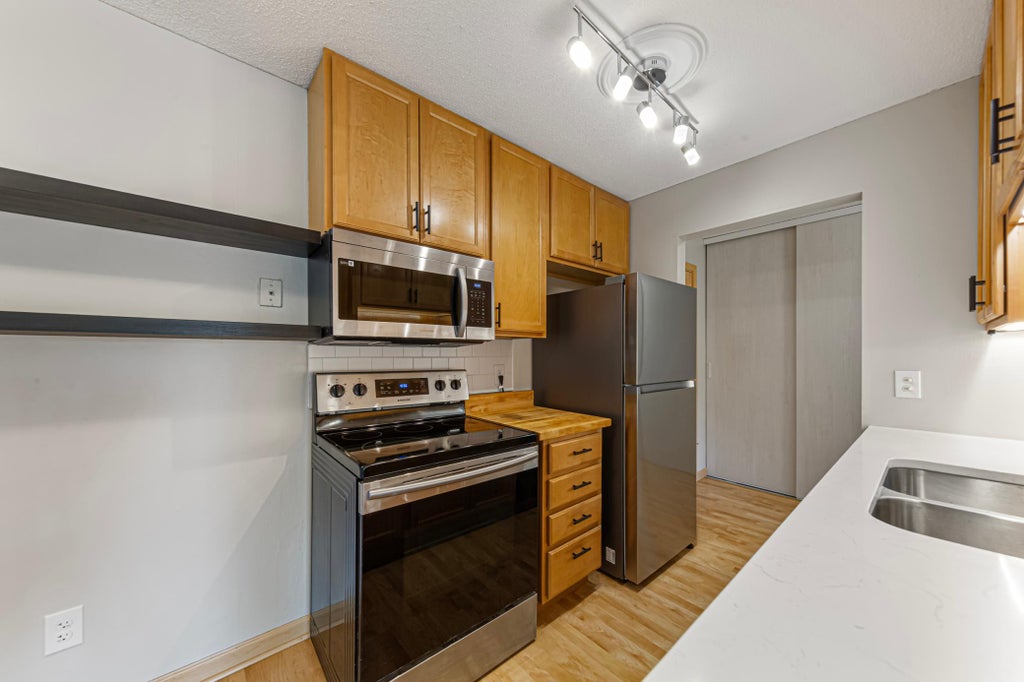 Photo of 2005 E 122nd Street #A11, Burnsville, MN 55337 (MLS # 7073637)