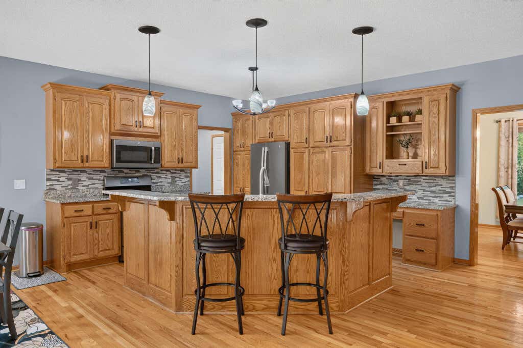 Photo of 11125 Woods Trail N, Champlin, MN 55316 (MLS # 7124360)
