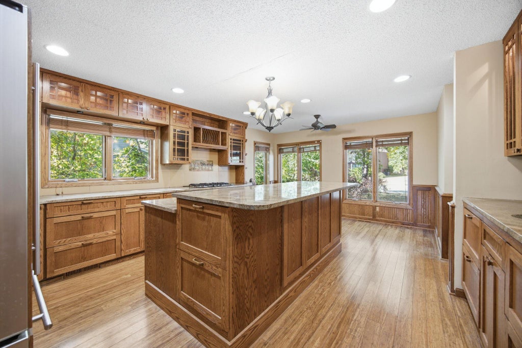Photo of 8031 Tierneys Woods Curve, Bloomington, MN 55438 (MLS # 7005035)