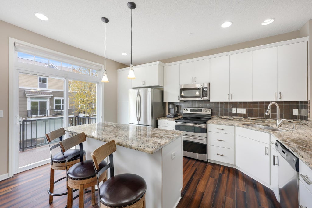 Photo of 11330 Sandcastle Drive #C, Woodbury, MN 55129 (MLS # 7119154)