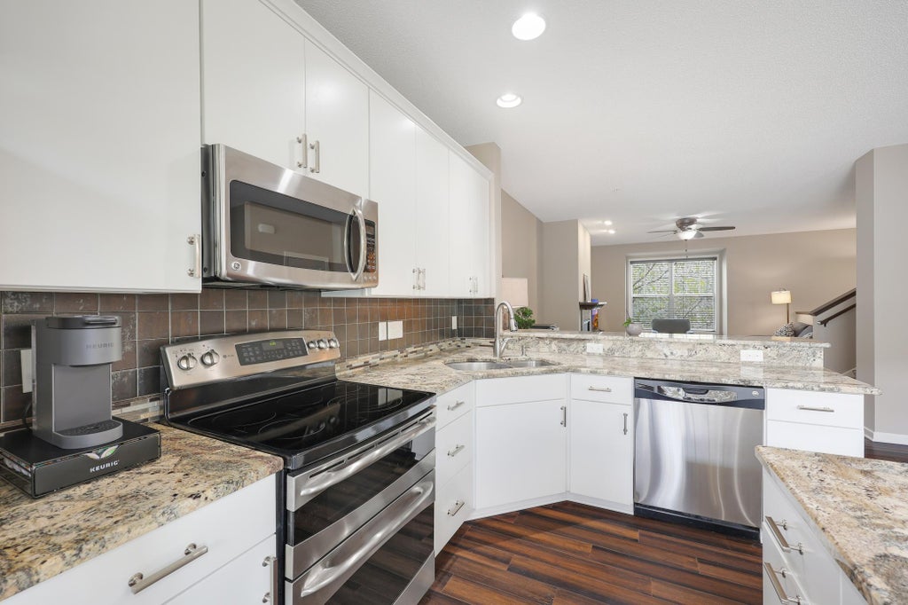 Photo of 11330 Sandcastle Drive #C, Woodbury, MN 55129 (MLS # 7119154)