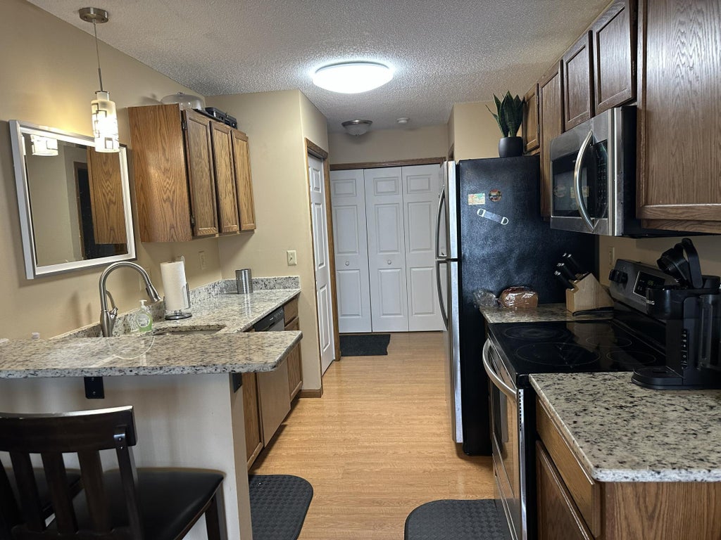 Photo of 1122 Pecks Woods Drive, New Brighton, MN 55112 (MLS # 7144373)