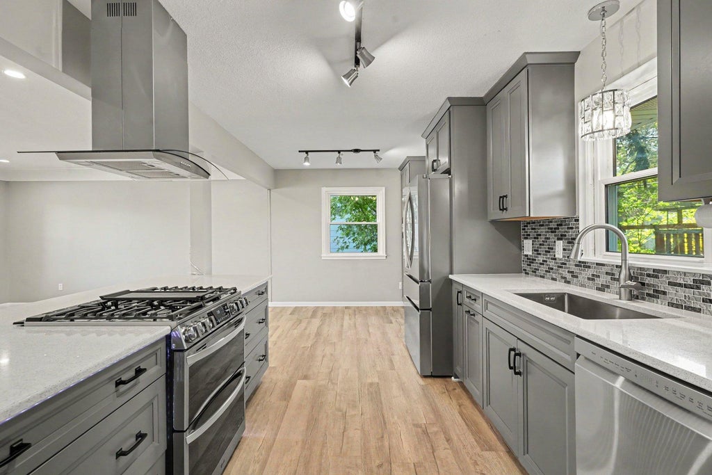 Photo of 950 22nd Avenue NW, New Brighton, MN 55112 (MLS # 7165818)