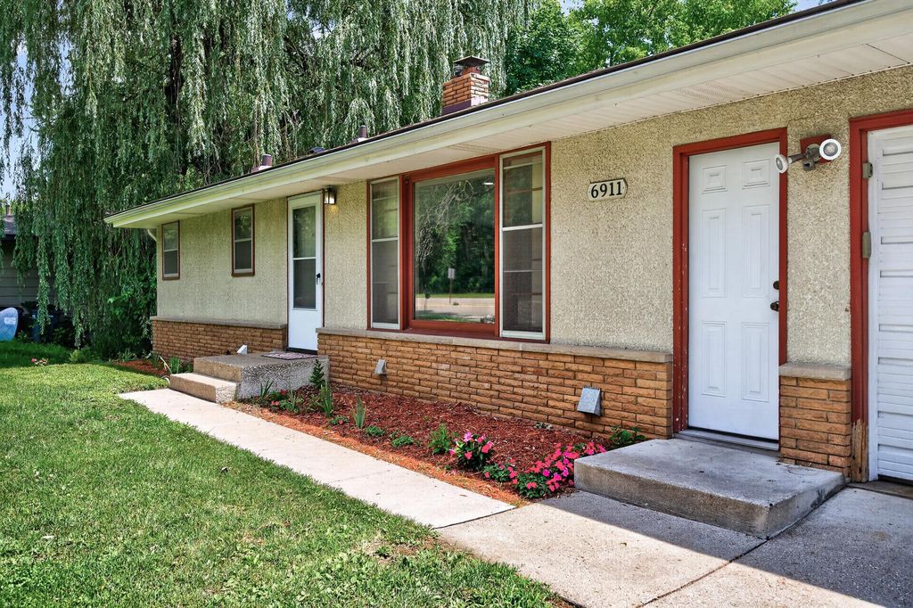 Photo of 6911 E River Road NE, Fridley, MN 55432 (MLS # 7106998)