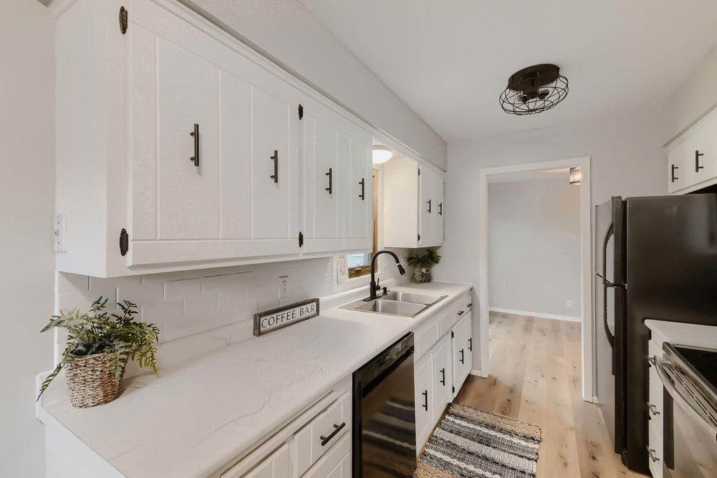 Photo of 10920 Kumquat Street NW, Coon Rapids, MN 55448 (MLS # 7105618)