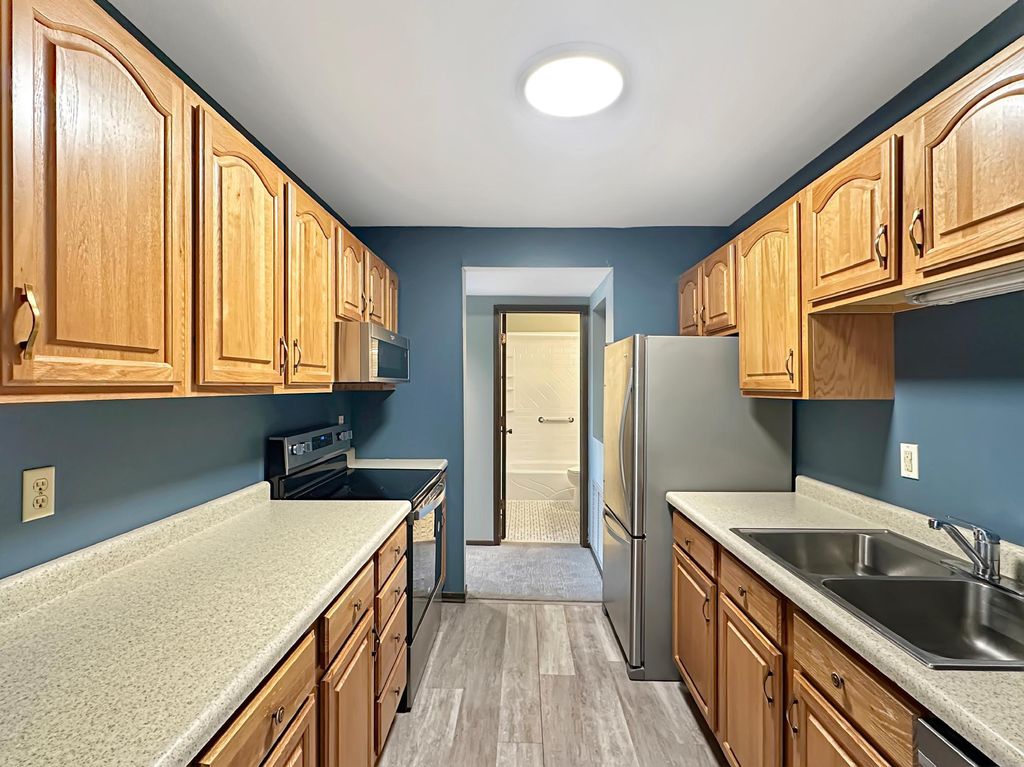 Photo of 122 Demont Avenue E #358, Little Canada, MN 55117 (MLS # 6815728)