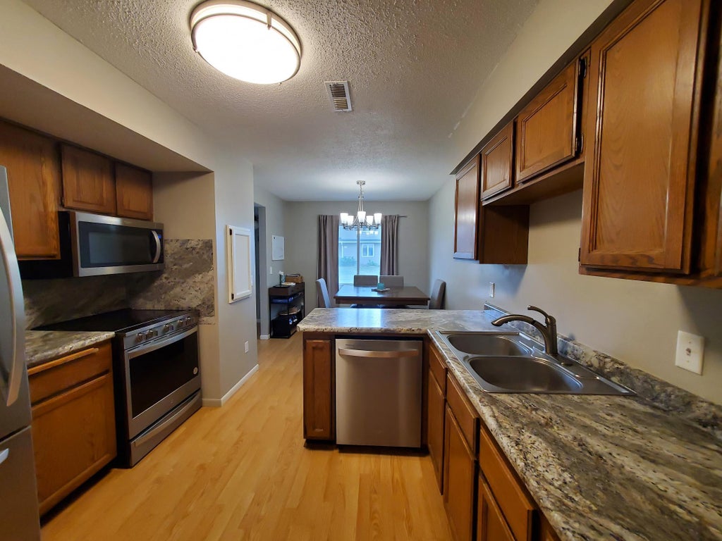 Photo of 9358 Ranchview Lane N, Maple Grove, MN 55369 (MLS # 7118269)