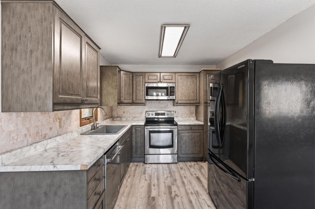 Photo of 7589 Homestead Avenue S, Cottage Grove, MN 55016 (MLS # 7072751)