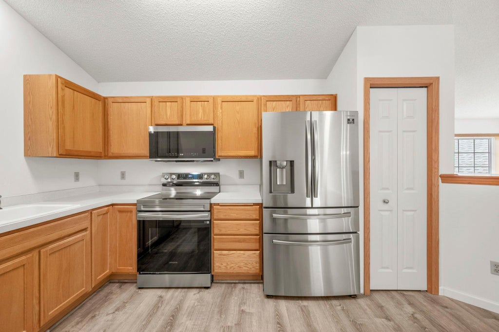 Photo of 9761 Zinnia Lane N, Maple Grove, MN 55369 (MLS # 7091970)