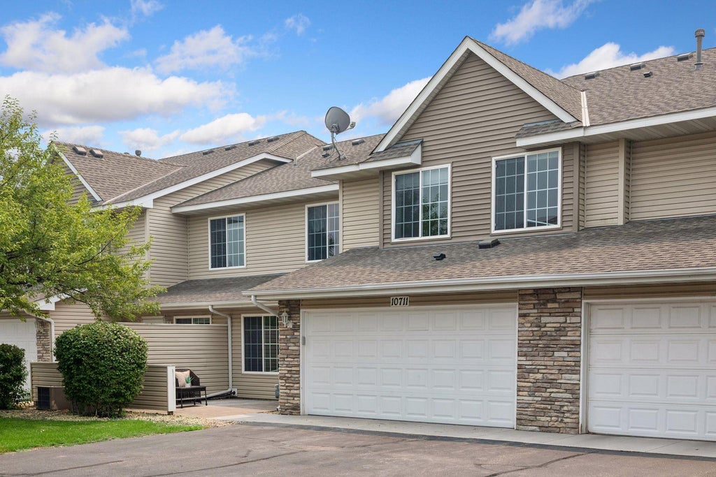 Photo of 10711 Unity Lane N, Brooklyn Park, MN 55443 (MLS # 7103310)