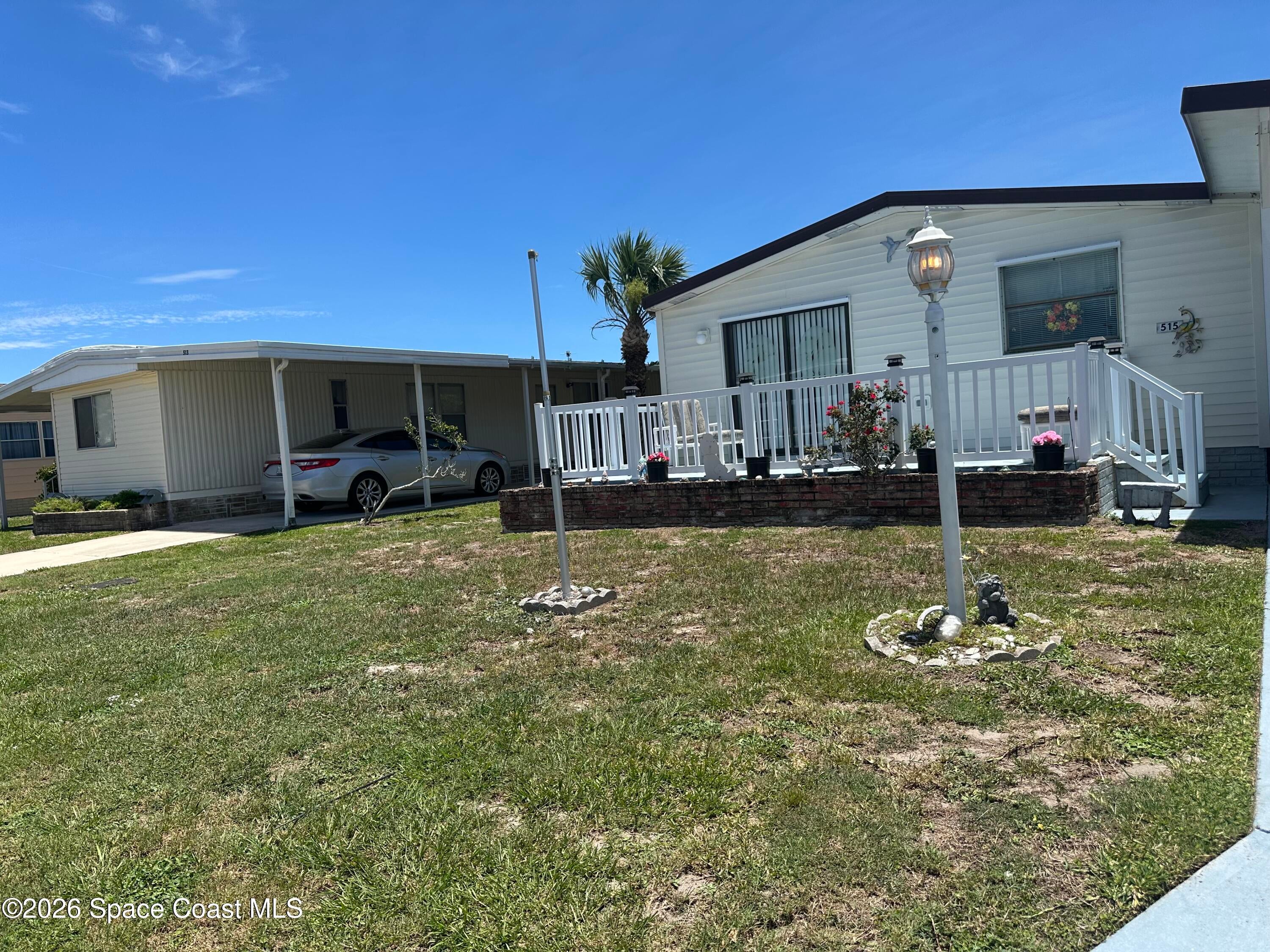 Photo 1 of 21 — 515 Royal Tern Drive N, Barefoot Bay, FL 32976