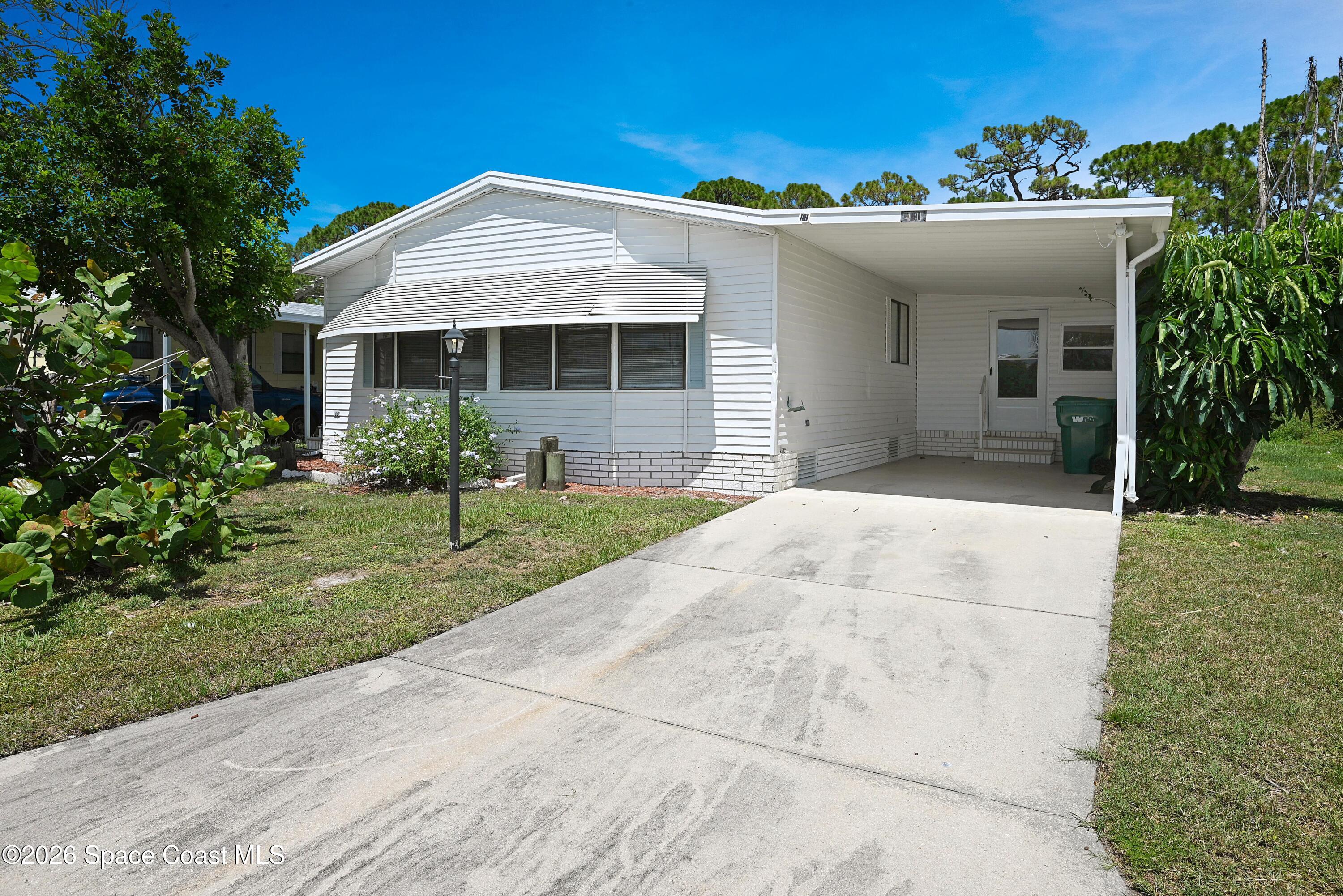 Photo 1 of 67 — 451 E Egret Circle, Barefoot Bay, FL 32976