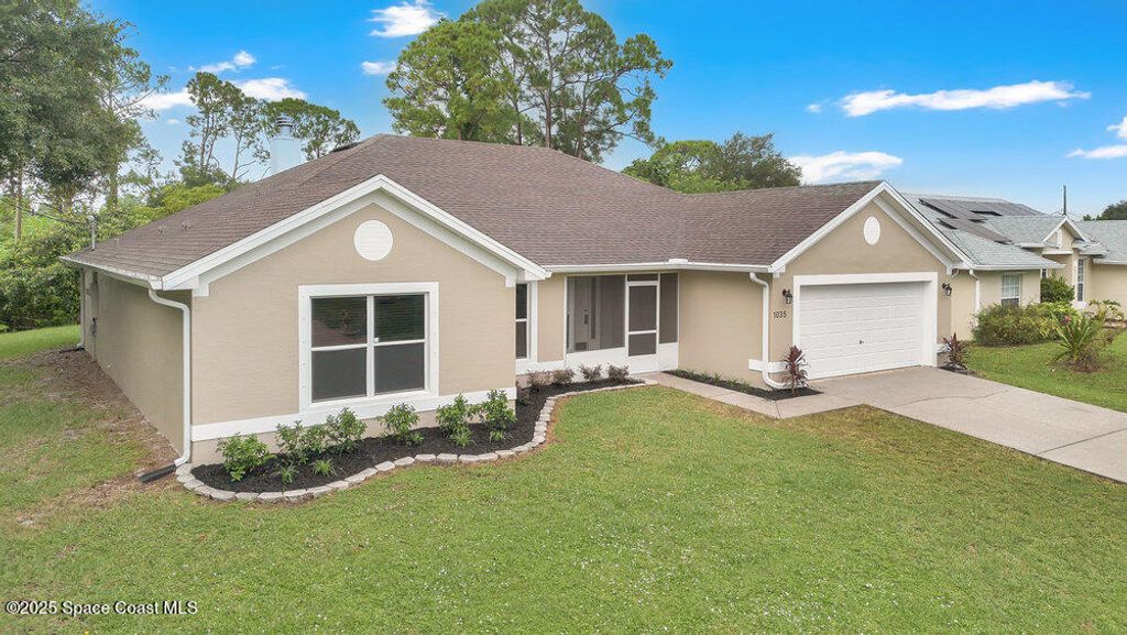 Photo of 1035 Utah Street SE, Palm Bay, FL 32909 (MLS # 1059060)