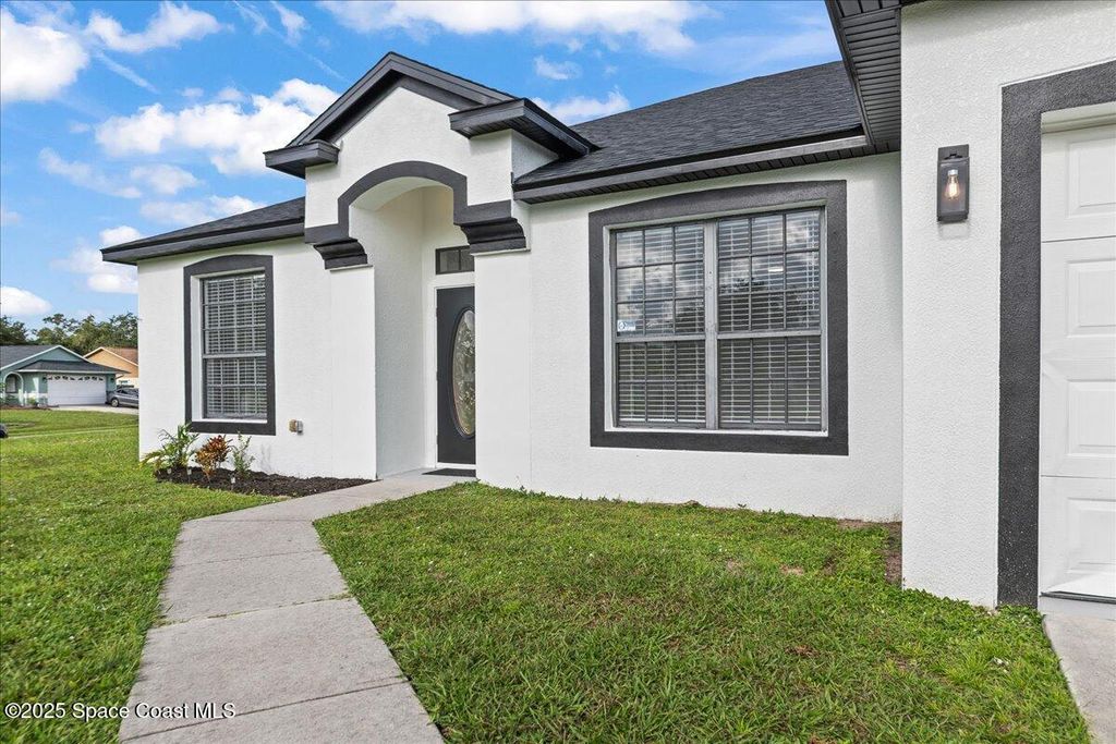 Photo of 269 Olivick Circle NE, Palm Bay, FL 32907 (MLS # 1058120)