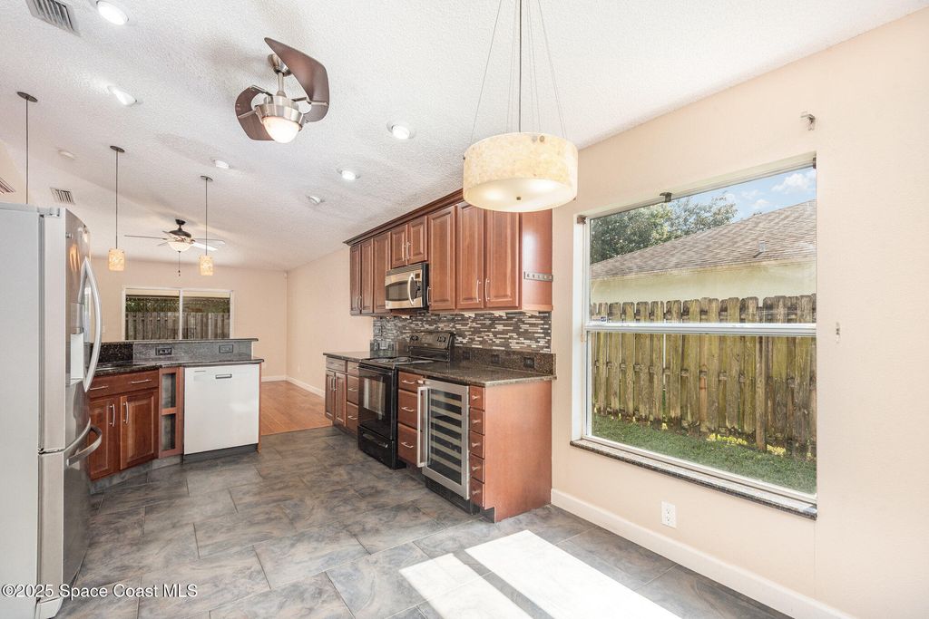 Photo of 4491 Derbyshire Drive, Titusville, FL 32780 (MLS # 1060301)