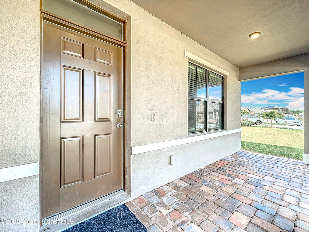 Photo of 870 Remington Greene Drive SE, Palm Bay, FL 32909 (MLS # 1055603)