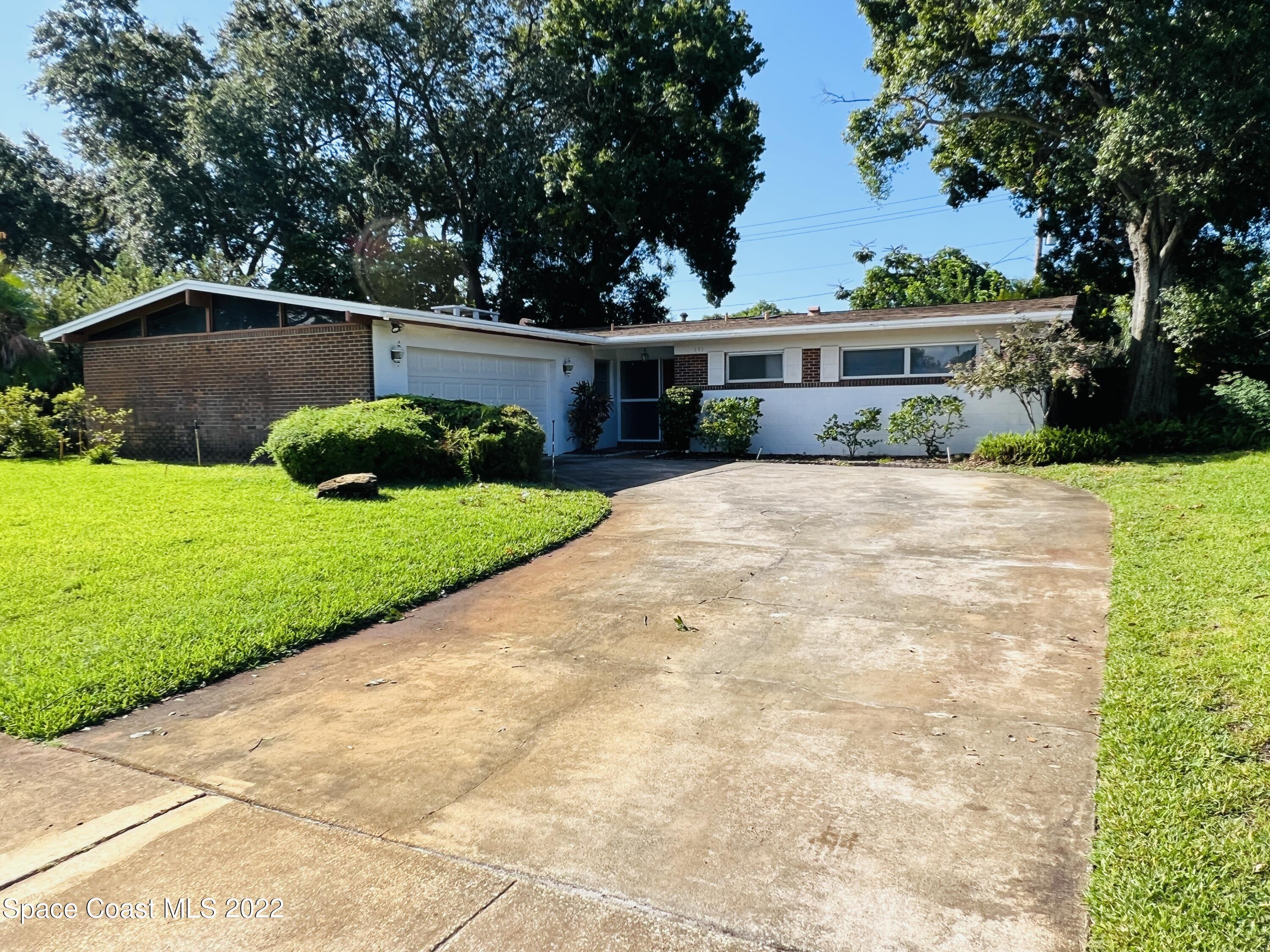 Photo 1 of 22 — 355 S Bel Aire Drive S, Merritt Island, FL 32952