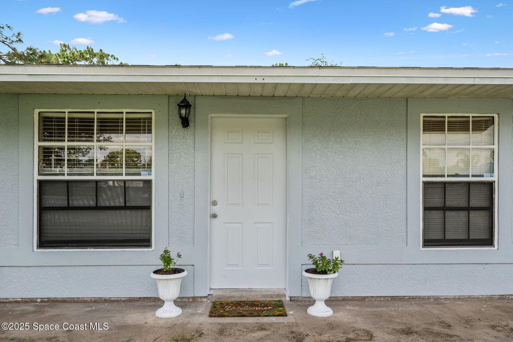 Photo of 206 San Luis Street SW, Palm Bay, FL 32908 (MLS # 1056009)