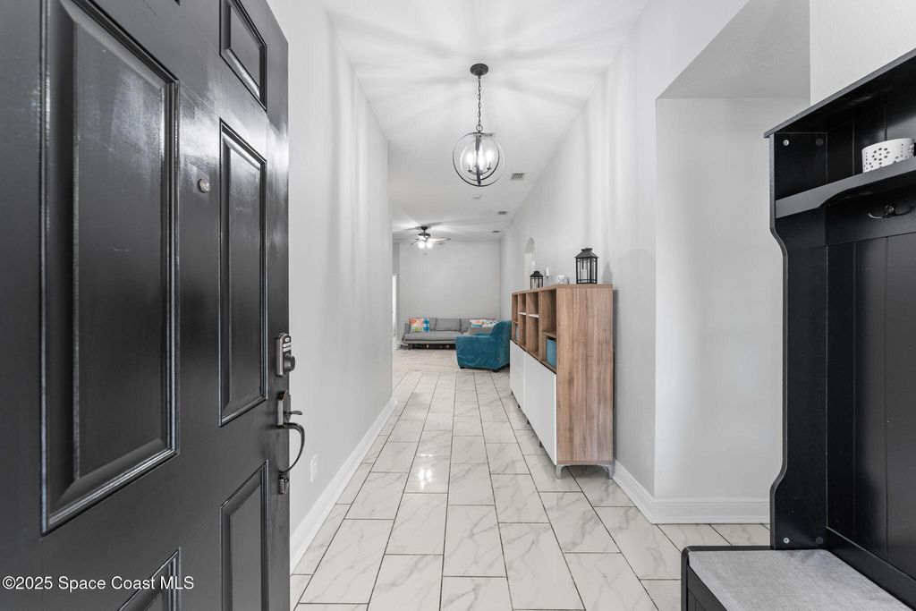 Photo of 301 Wishing Well Circle SW, Palm Bay, FL 32908 (MLS # 1055705)