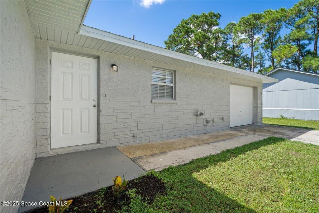 Photo of 680 Bluefields Street SE, Palm Bay, FL 32909 (MLS # 1059071)