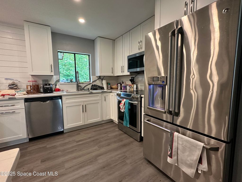 Photo of 849 Americana Boulevard NE, Palm Bay, FL 32907 (MLS # 1056743)