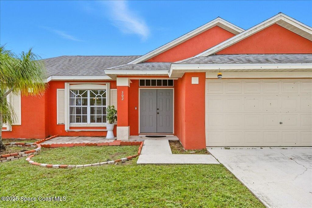 Photo of 302 Arapahoe Lane NE, Palm Bay, FL 32907 (MLS # 1059254)