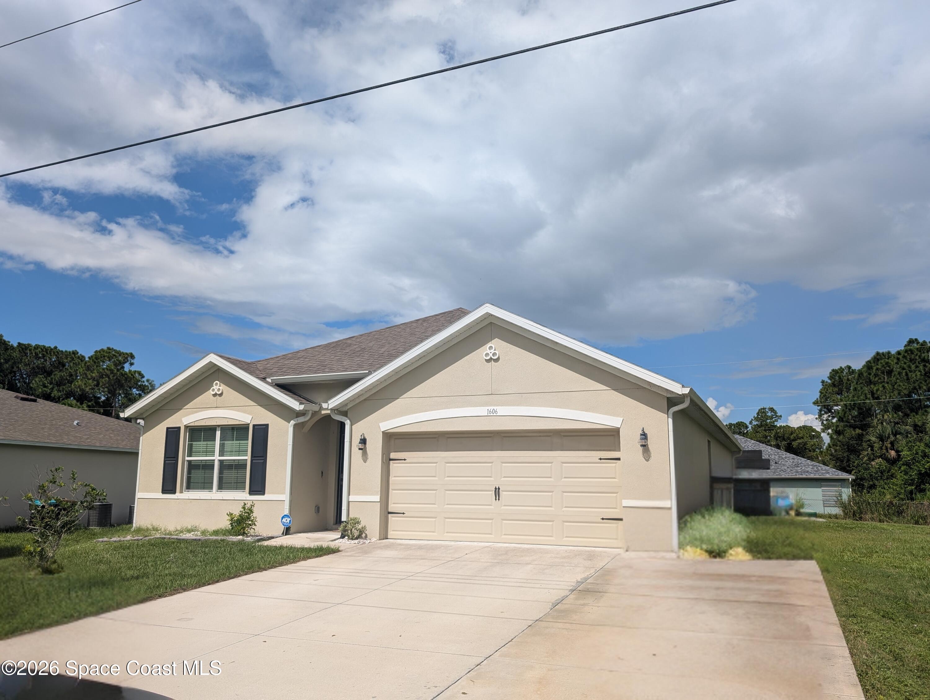 Photo 1 of 18 — 1606 De Groodt Road SW, Palm Bay, FL 32908