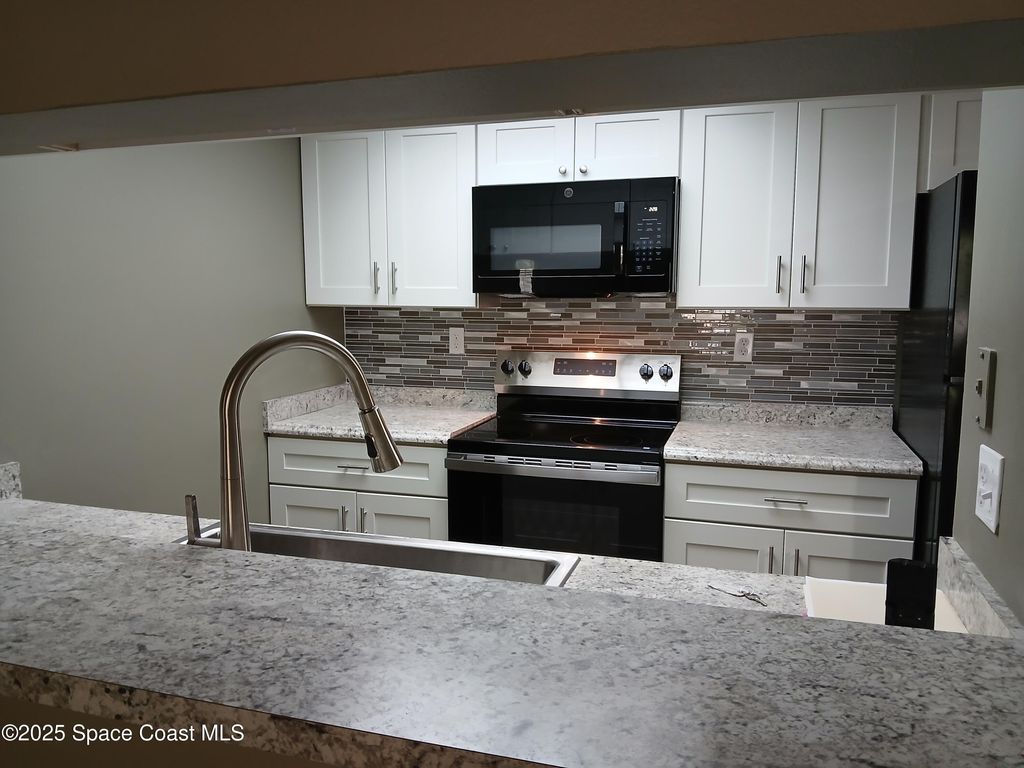 Photo of 1617 Sunny Brook Lane NE #F103, Palm Bay, FL 32905 (MLS # 1056858)