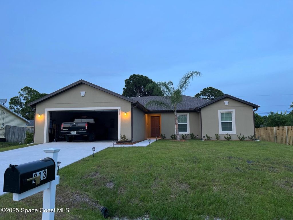 Photo of 813 SE Taluga Avenue SE, Palm Bay, FL 32909 (MLS # 1058966)