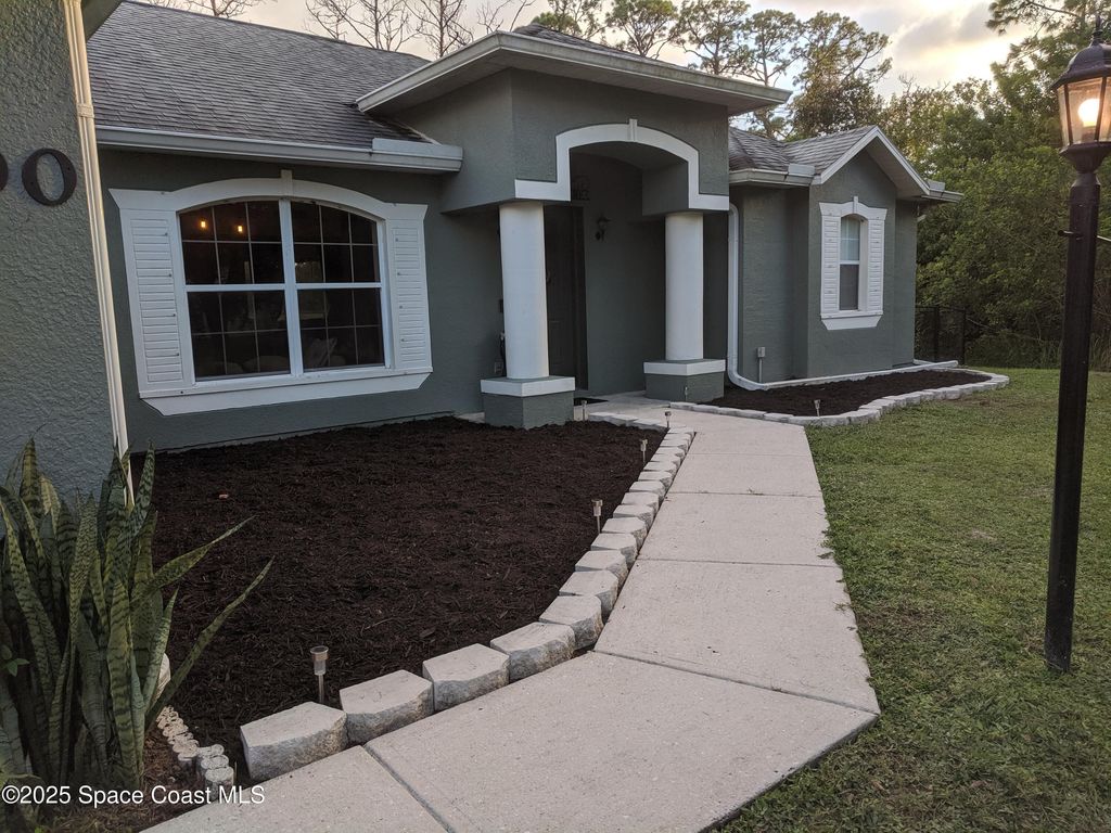 Photo of 690 Henlock Street SE, Palm Bay, FL 32909 (MLS # 1055997)