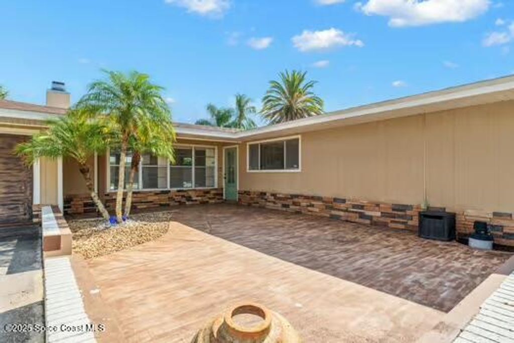 Photo of 933 Waialae Circle NE, Palm Bay, FL 32905 (MLS # 1057454)