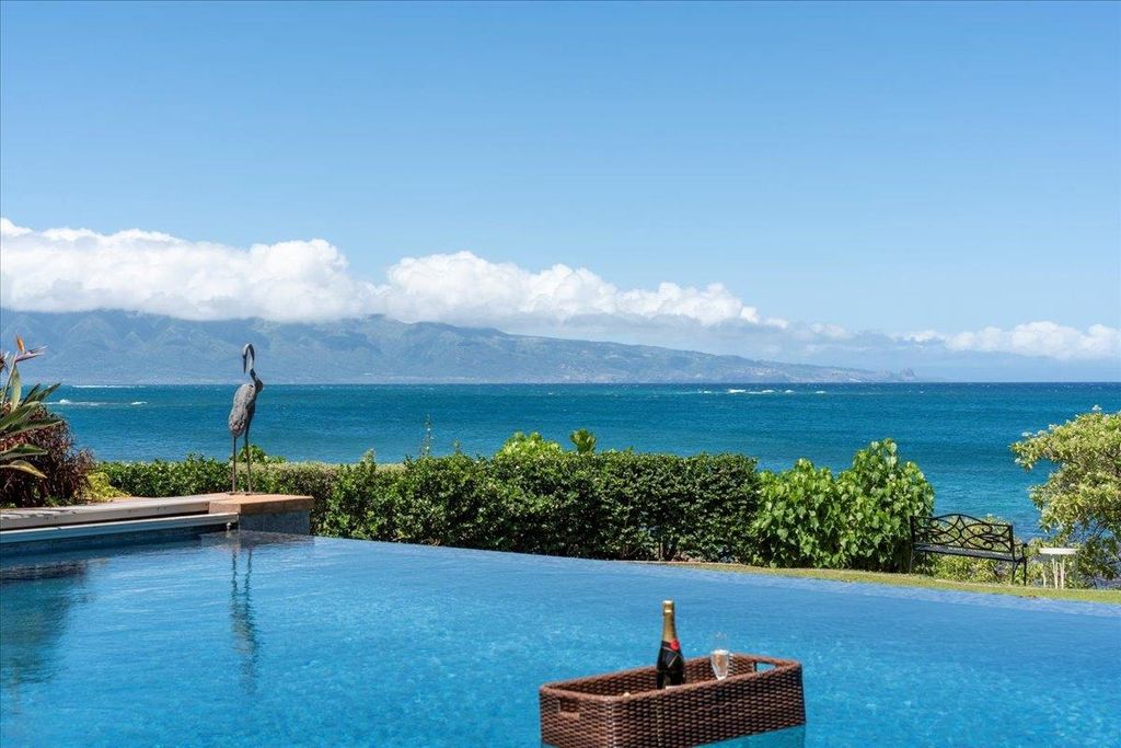 Photo of 21 Kaulua Pl, Paia, HI 96779 (MLS # 405426)