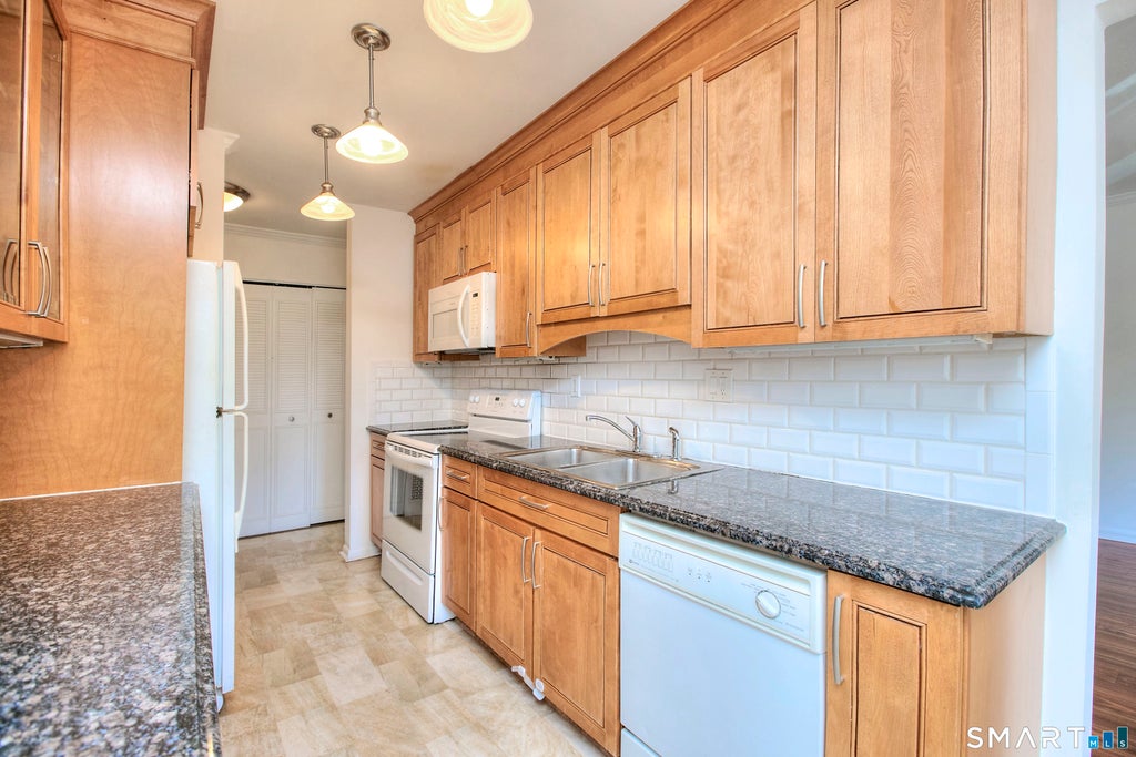 Photo of 109 Southport Woods Drive #109, Fairfield, CT 06825 (MLS # 24201683)