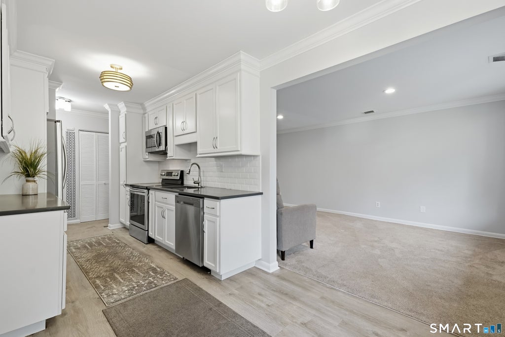 Photo of 110 Southport Woods Drive #110, Fairfield, CT 06825 (MLS # 24197927)