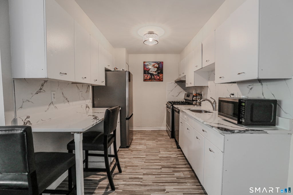 Photo of 30 Woodland Street #5F, Hartford, CT 06105 (MLS # 24208362)