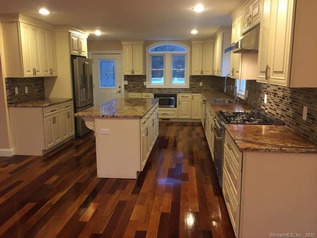 Photo of 647 New Haven Avenue, Milford, CT 06460 (MLS # 24175143)