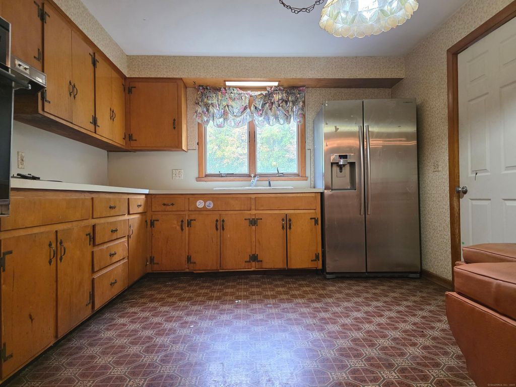 Photo of 144 Woodlawn Drive, Torrington, CT 06790 (MLS # 24131968)