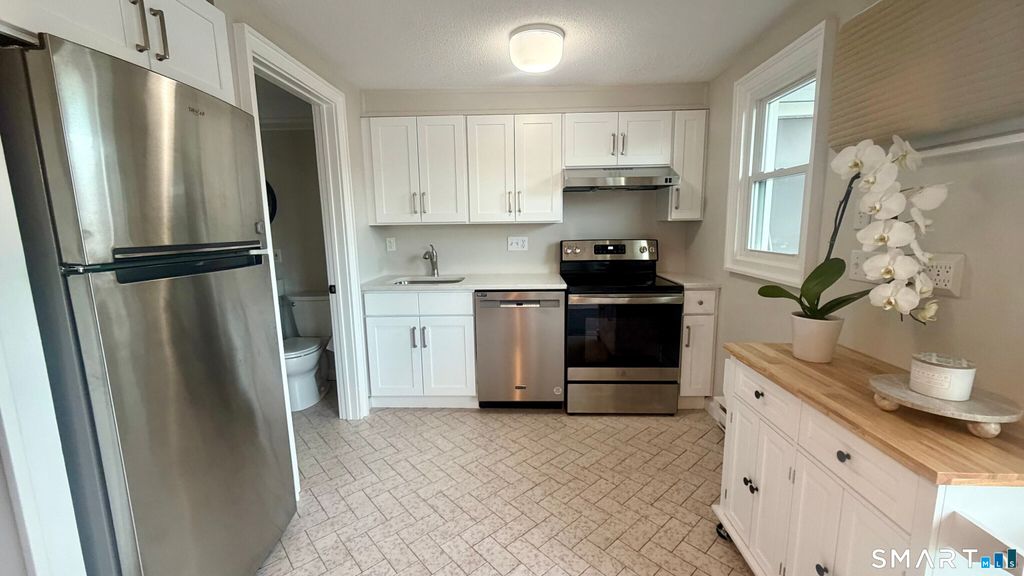 Photo of 211 E Main Street #E50, Branford, CT 06405 (MLS # 24150389)