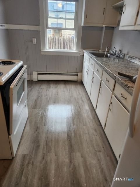 Photo of 46 Maple Street #1st floor rear, Plainville, CT 06062 (MLS # 24176051)