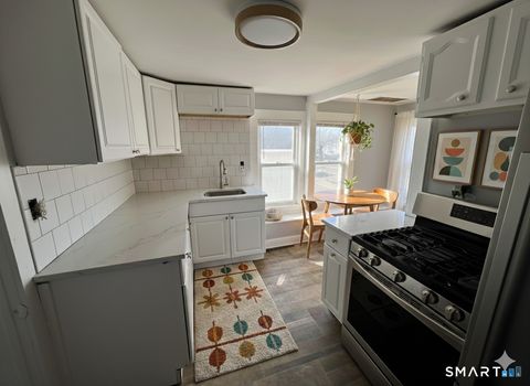 Photo of 121 Hawley Avenue #D, Milford, CT 06460 (MLS # 24149619)