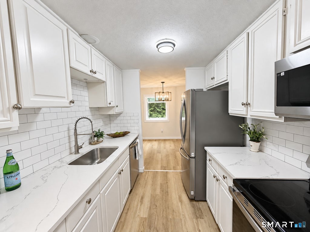 Photo of 6 E Hayes Road, East Hampton, CT 06424 (MLS # 24206101)