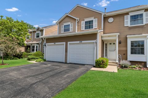 Photo of 379 Ascot Lane, Streamwood, IL 60107 (MLS # 12651332)