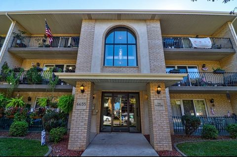 Photo of 6655 W 64th Place #104, Chicago, IL 60638 (MLS # 12640749)