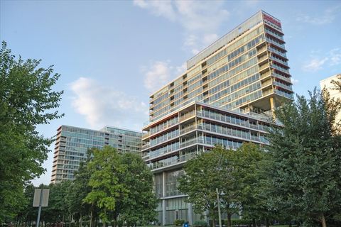 Photo of 9715 Woods Drive #1110, Skokie, IL 60076 (MLS # 12519829)