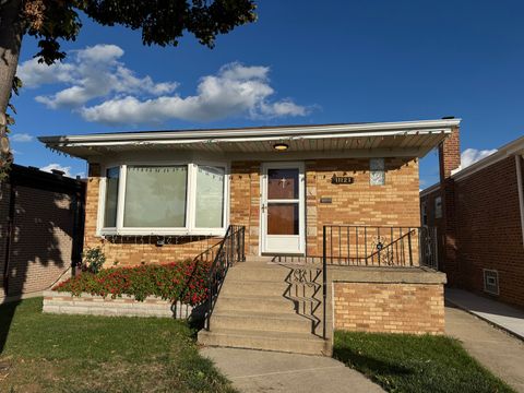 Photo of 11121 S Avenue L, Chicago, IL 60617 (MLS # 12502911) Photo of 11121 S Avenue L, Chicago, IL 60617 (MLS # 12502911)