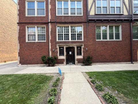 Photo of 7015 S Paxton Avenue #101, Chicago, IL 60649 (MLS # 12717118)