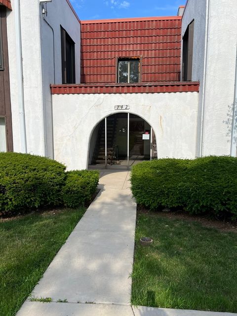 Photo of 743 E Fullerton Avenue #103, Glendale Heights, IL 60139 (MLS # 12409325)