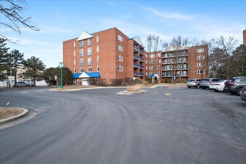 Photo of 6755 N Milwaukee Avenue #404, Niles, IL 60714 (MLS # 12575305)