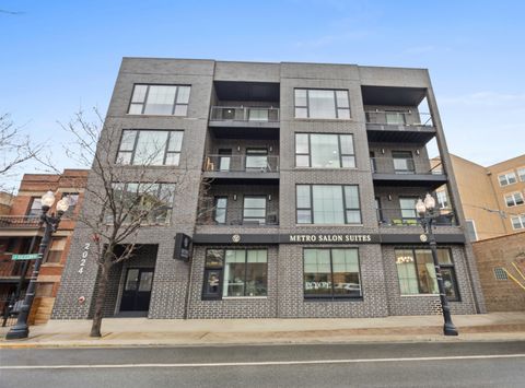 Photo of 2024 W Irving Park Road #302, Chicago, IL 60618 (MLS # 12639917)
